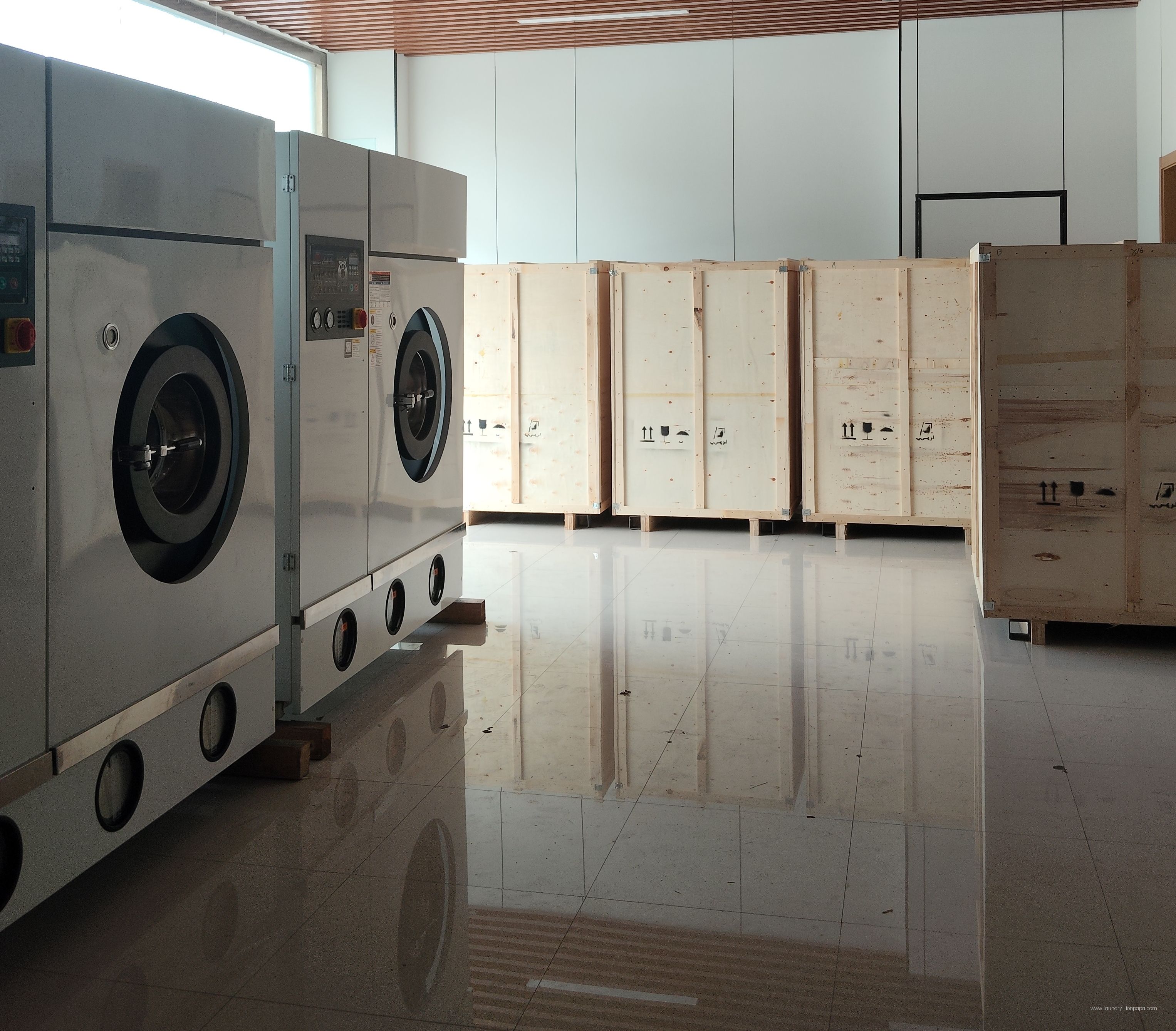 Laundry machines and shipping crates prepared for dispatch