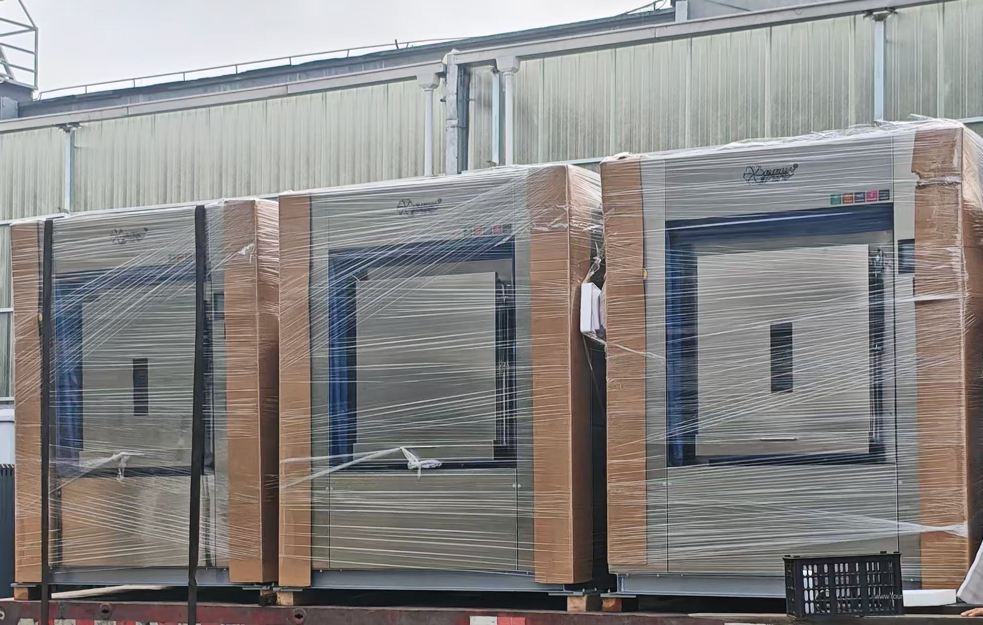 Packaged laundry equipment ready for transport