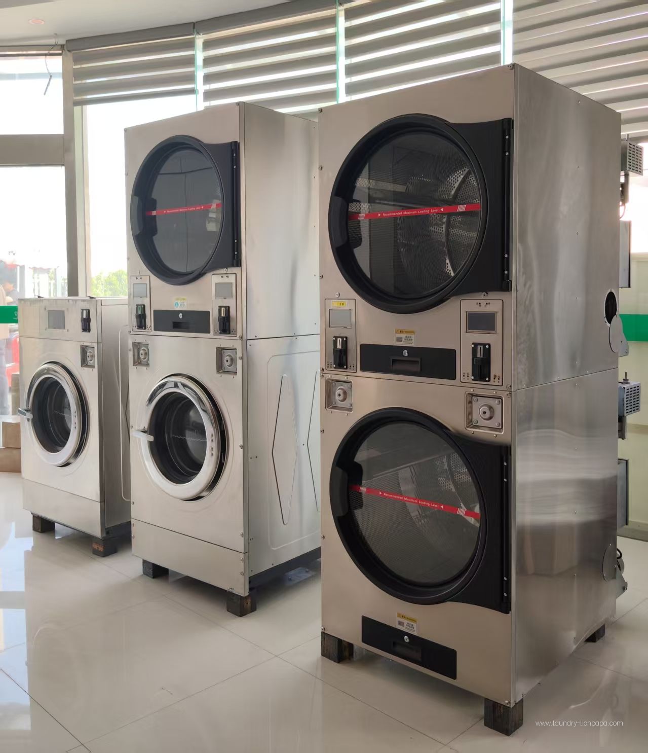 Single washer, stacked washer-dryer and double-stack dryer on display
