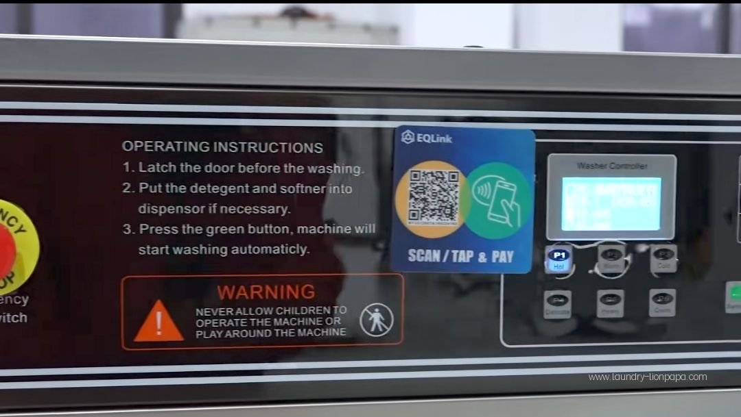 Example of a scan-to-pay interface beside laundry machine controls